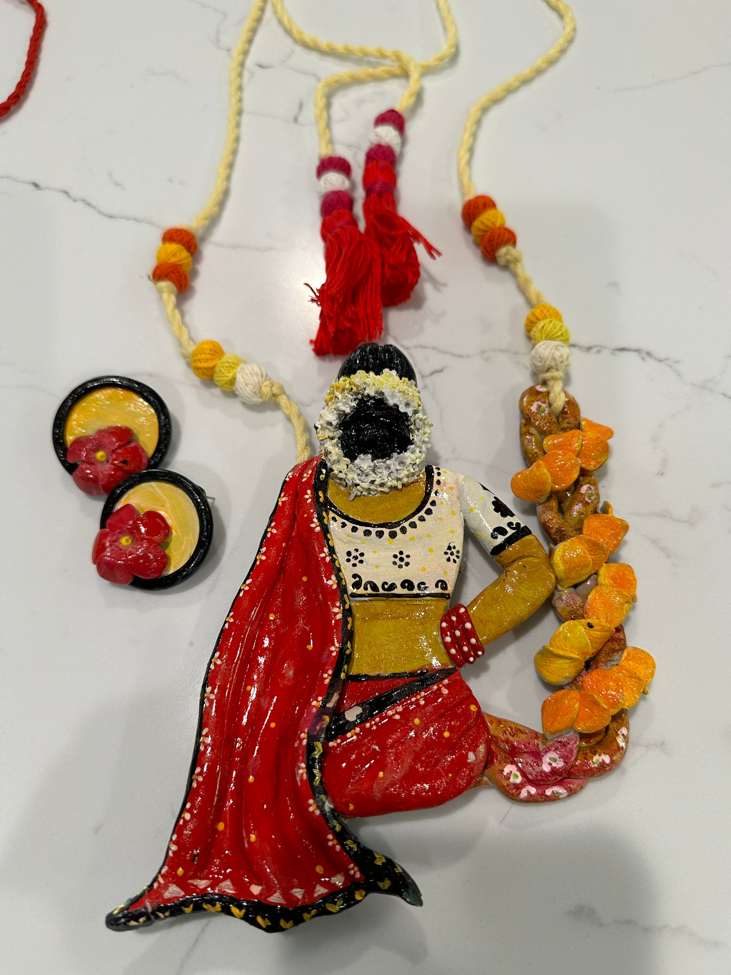 Artificial Clay Jewelry - Lady draped in a saree sitting on a flower swing (Red)