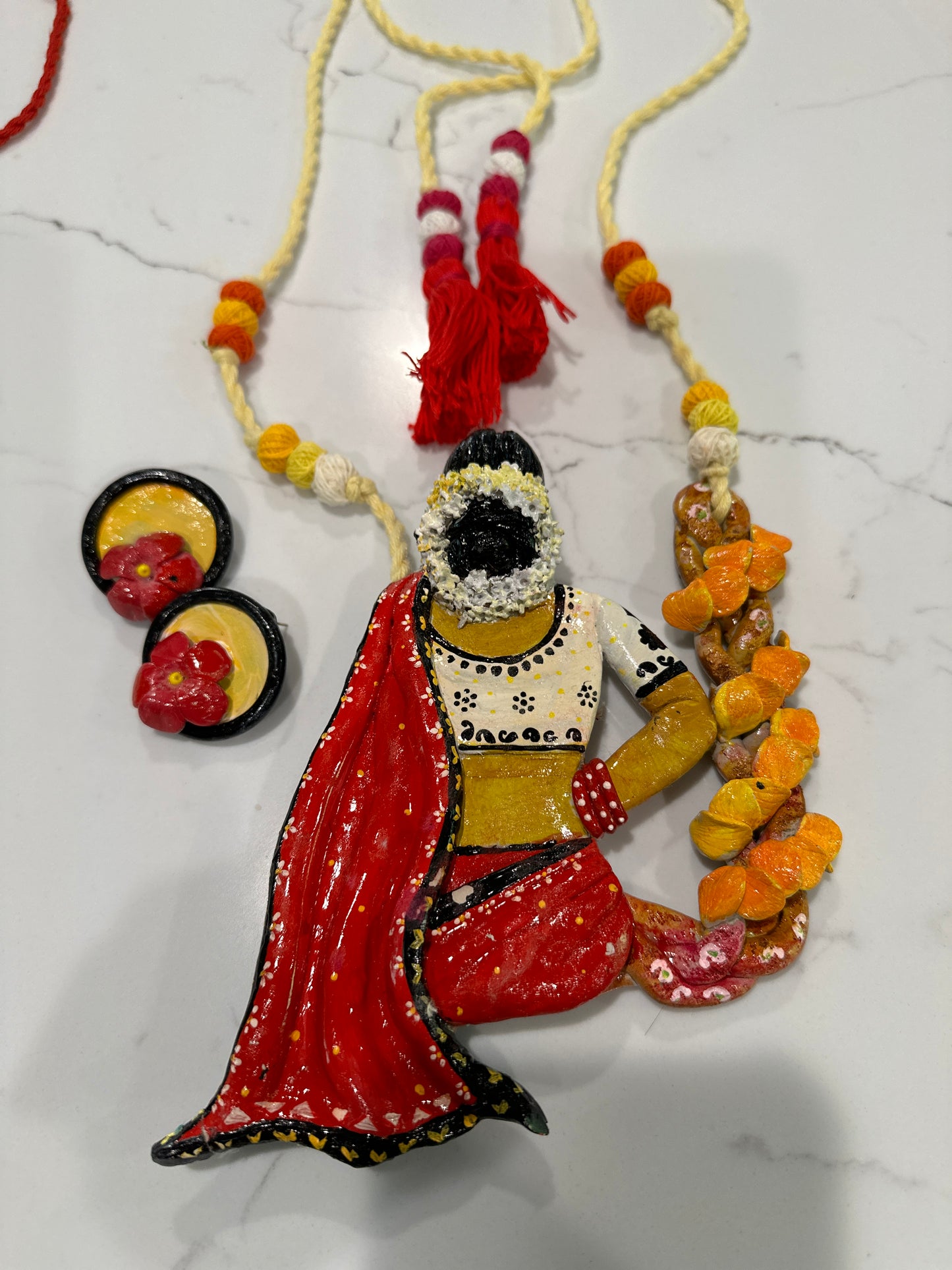 Artificial Clay Jewelry - Lady draped in a saree sitting on a flower swing (Red)