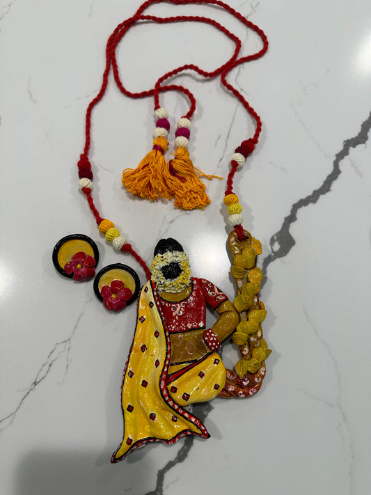 Artificial Clay Jewelry - Lady draped in a saree sitting on a flower swing (Yellow)