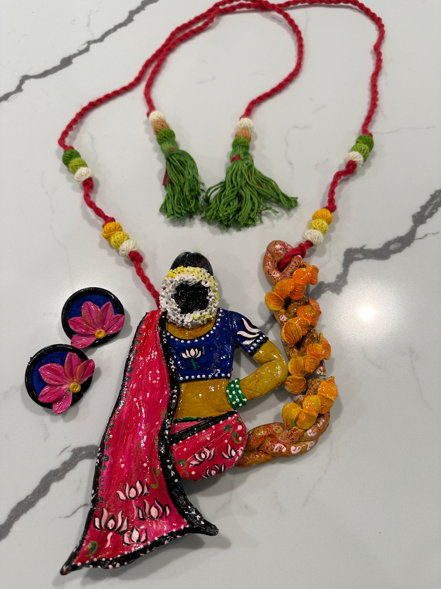 Artificial Clay Jewelry - Lady draped in a saree sitting on a flower swing (Red)