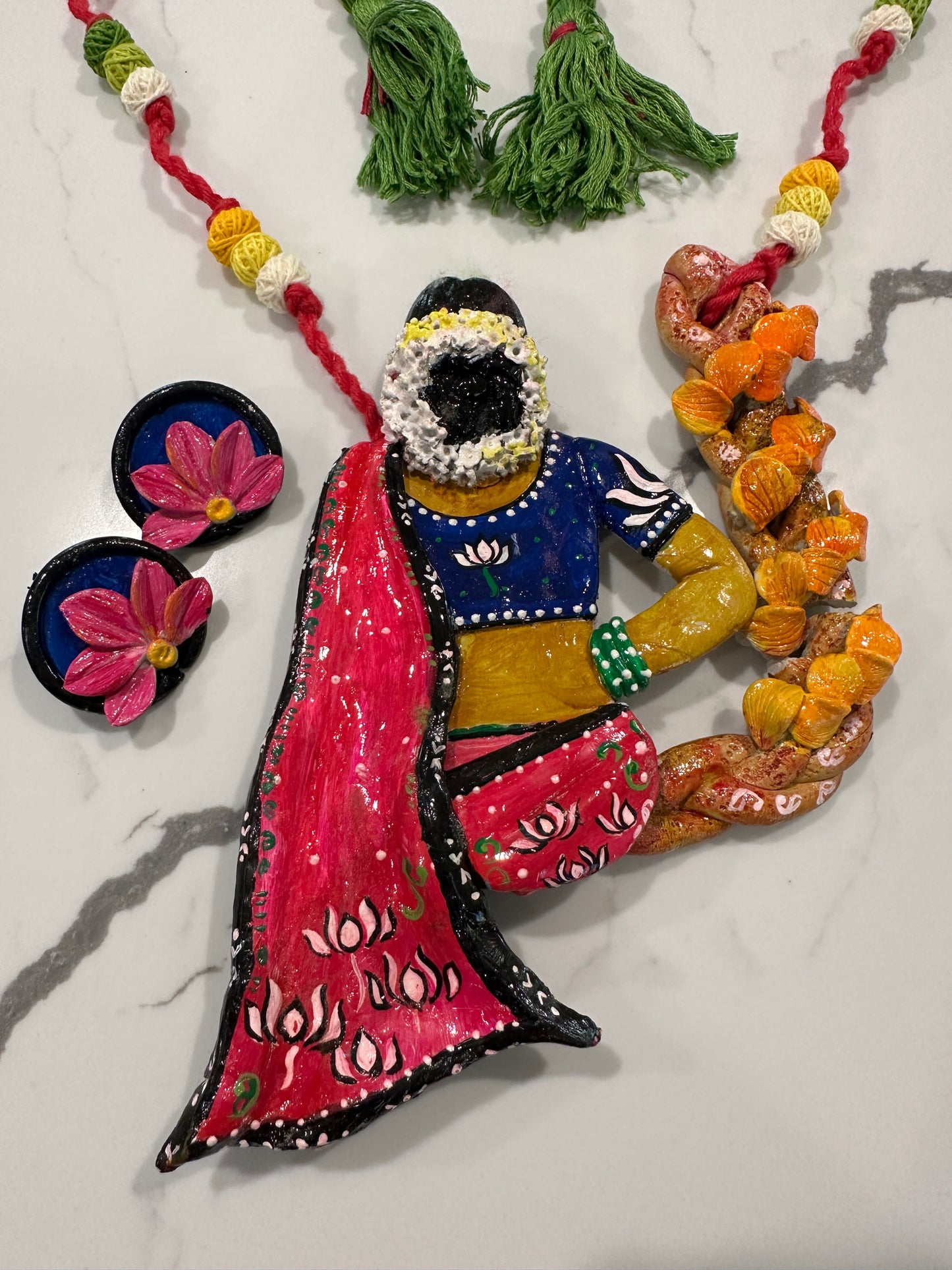 Artificial Clay Jewelry - Lady draped in a saree sitting on a flower swing (Red)